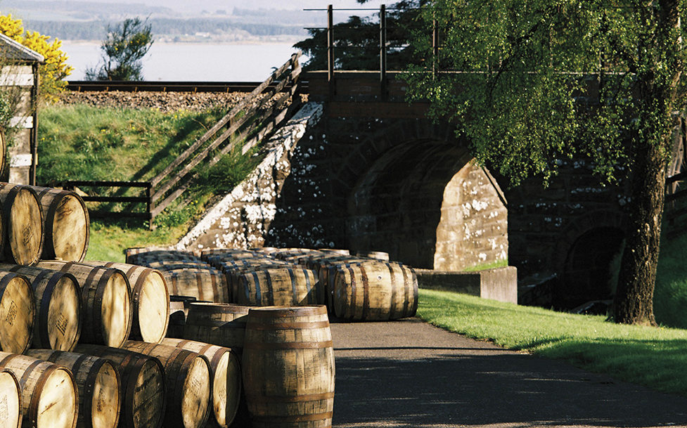 A barrel of 30 year old whisky sitting outside a distillery.