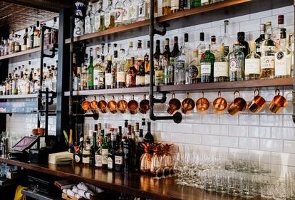 Back bar and gantry with wine bottles and glasses at Ledbury Restaurant