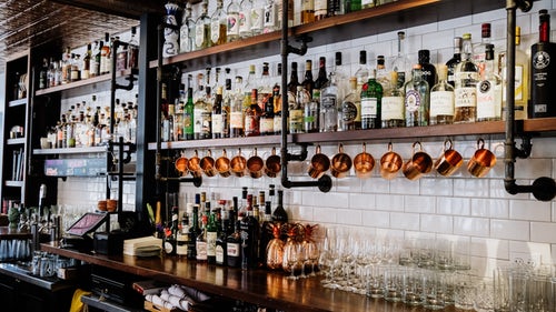 Back bar and gantry with wine bottles and glasses at Ledbury Restaurant